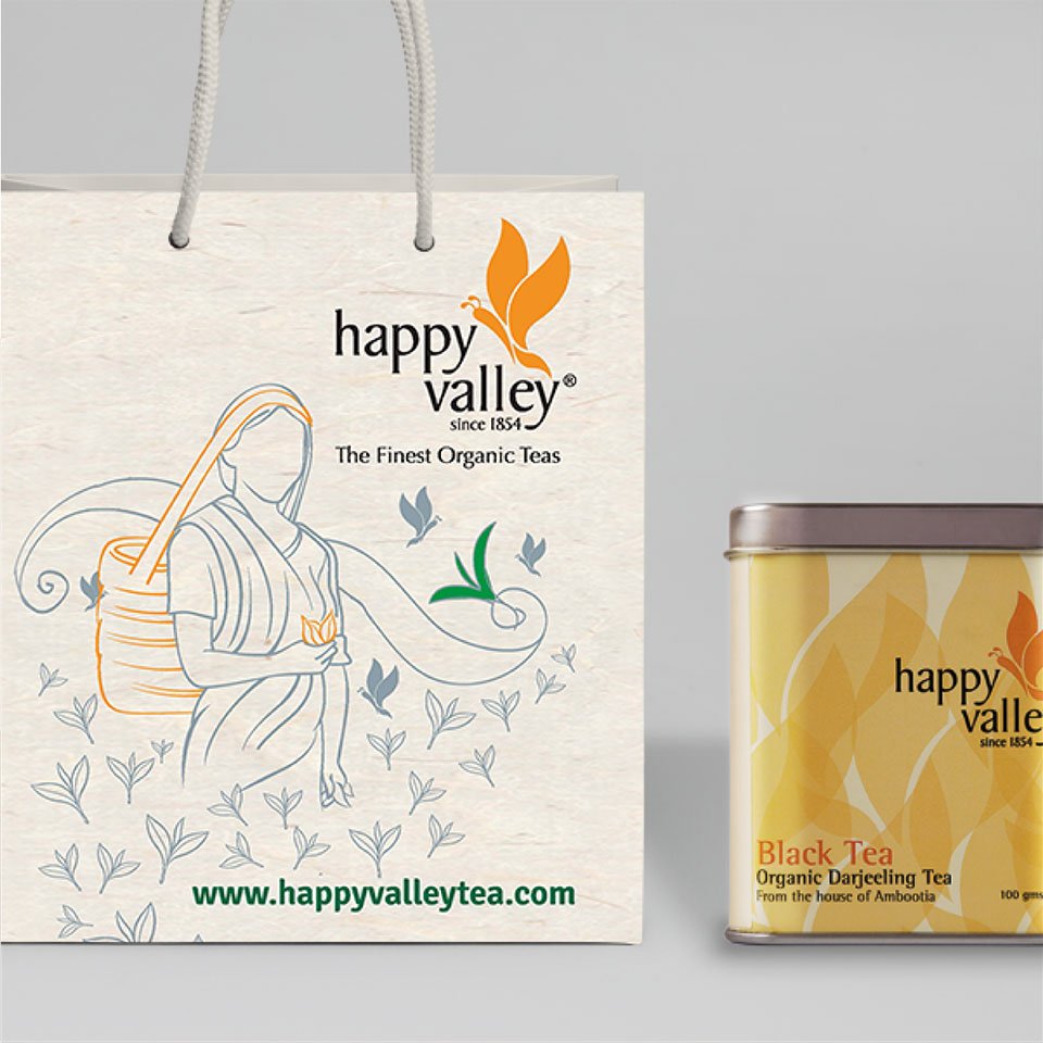 https://old.wysiwyg.co.in/sites/default/files/worksThumb/Ambootia-happy-valley-garden-packaging-paper-bag-2017.jpg